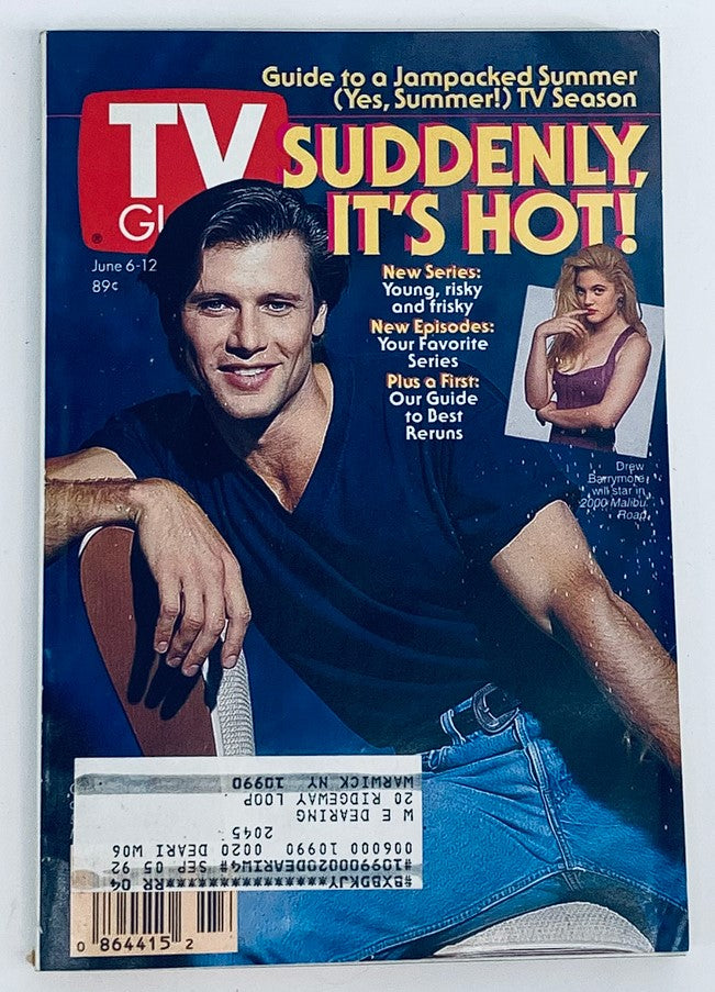 Cover of TV Guide Magazine from June 6, 1992, featuring bold headline 'Suddenly, It's Hot!' The image showcases a male model in a black V-neck shirt and light blue jeans, with a female model in the background. The magazine highlights new summer TV shows, making it a nostalgic piece for collectors.