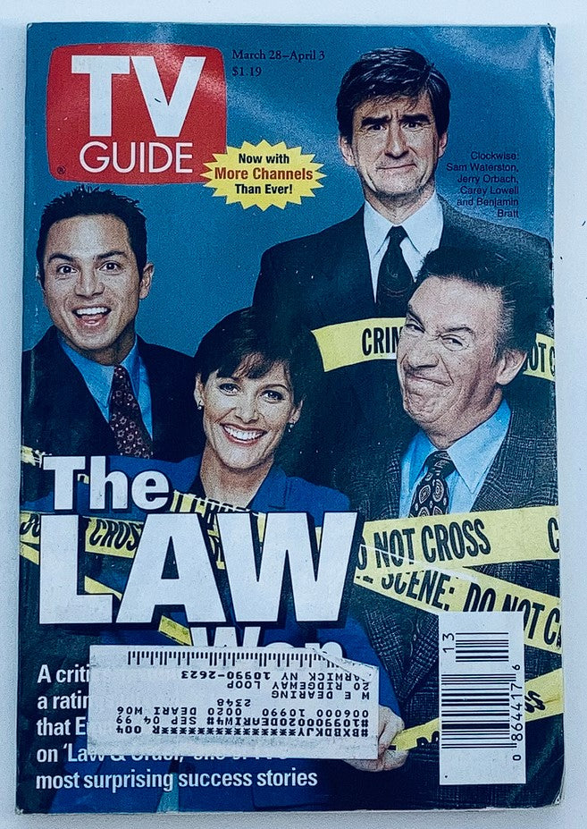 TV Guide Magazine cover from March 28, 1998, featuring 'The Law'. The cover showcases actors Benjamin Bratt, Carey Lowell, and others, with promotional text on channel offerings and iconic crime drama themes.