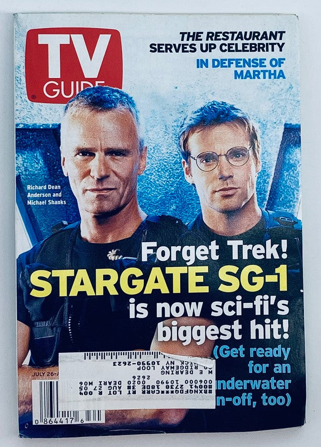 TV Guide Magazine July 26 2003 featuring Richard Dean Anderson and Michael Shanks on the cover, promoting 'Stargate SG-1' as sci-fi's biggest hit. This vintage magazine cover showcases the actors in a dynamic pose, highlighting their connection to the iconic show.