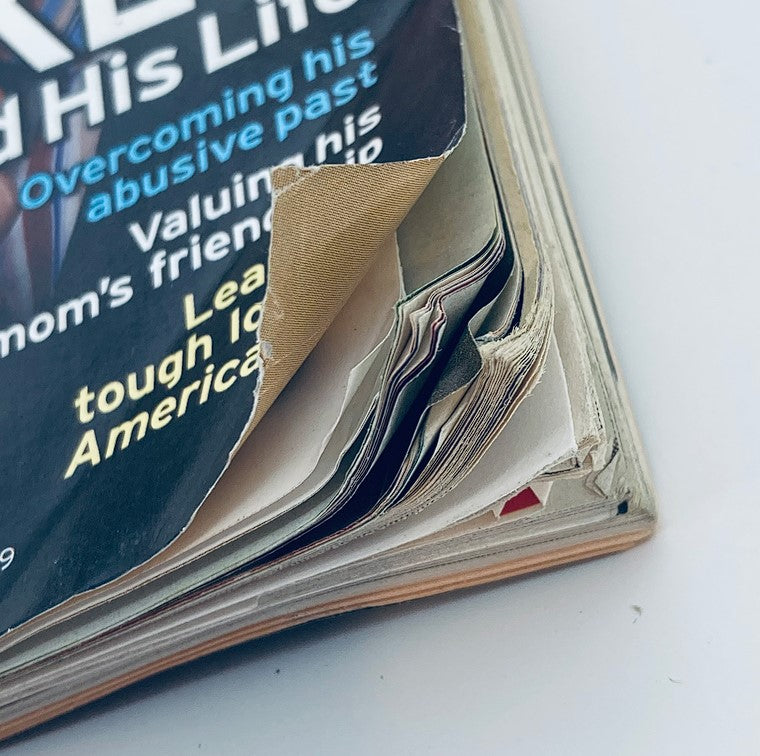 Close-up of the TV Guide Magazine November 14 2004 cover featuring Clay Aiken, showcasing the magazine's worn edges and folded pages, reflecting its vintage condition and collectors' appeal.