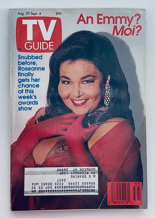 TV Guide Magazine cover from August 29, 1992 featuring Roseanne Barr with the title 'An Emmy? Moi?'. The cover showcases Roseanne in a glamorous pose, wearing red gloves and sparkling earrings, highlighting her significance in television history.
