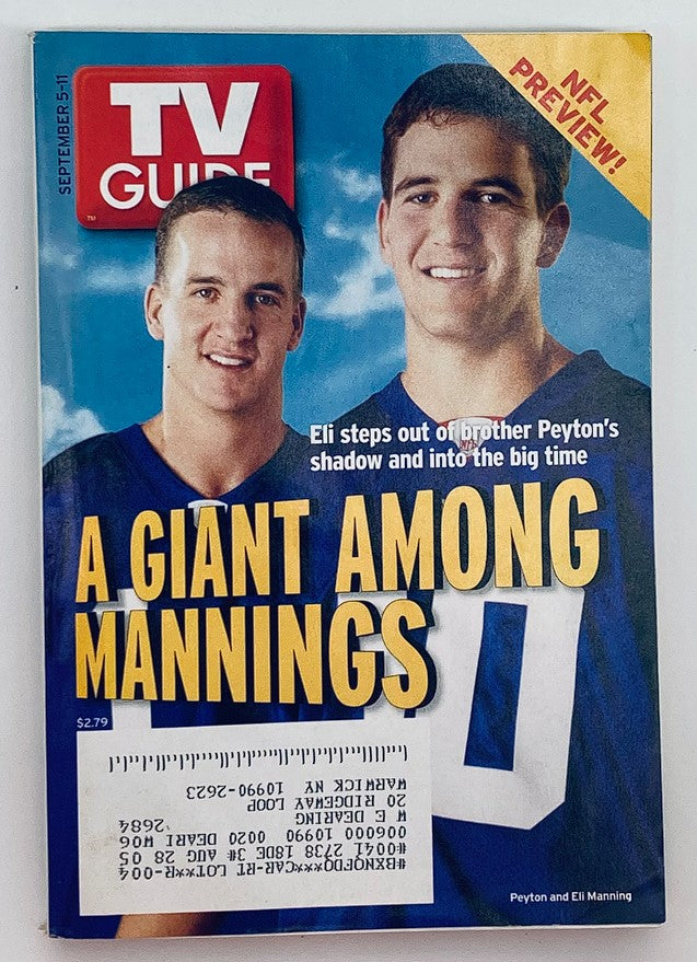 TV Guide Magazine September 5 2004 featuring Eli Manning and Peyton Manning on the cover, highlighting them as a prominent duo in NFL history with the headline 'A Giant Among Mannings'.