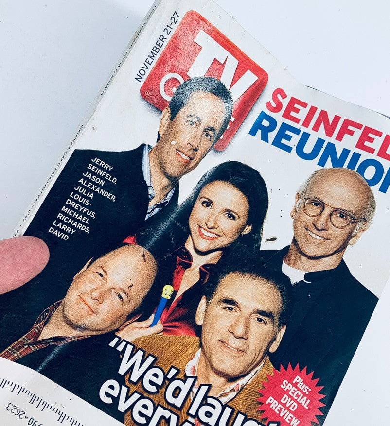 A close-up of TV Guide Magazine November 21, 2004 cover showing the Seinfeld reunion with Jason Alexander, Jerry Seinfeld, and Larry David, focusing on the iconic cast and their legacy in comedy.