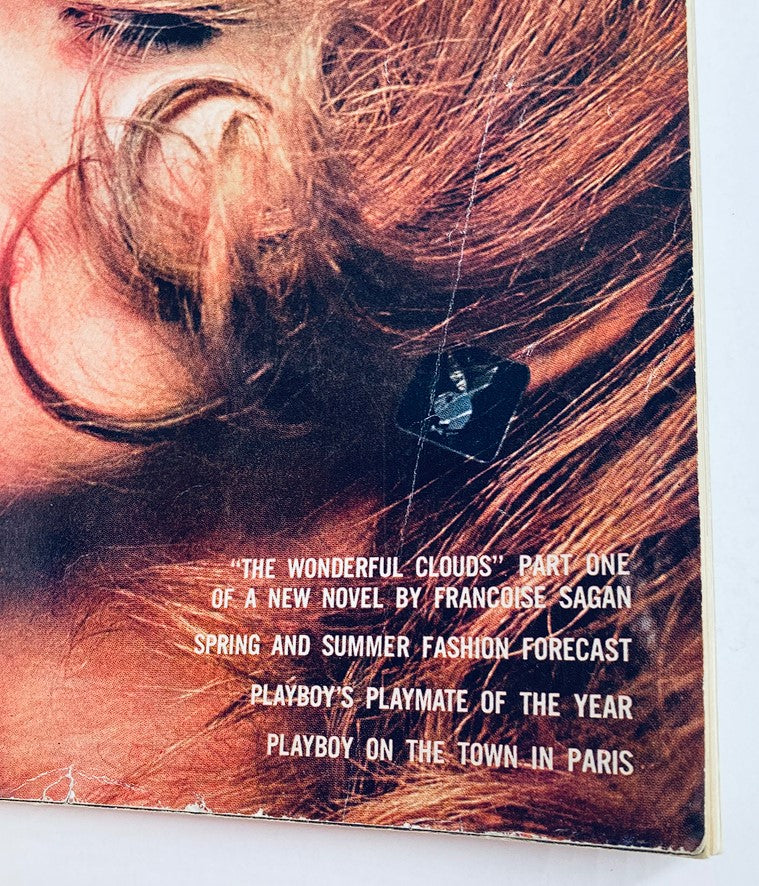 Back cover of VTG Playboy Magazine April 1962 displaying an excerpt and details about featured articles, including 'The Wonderful Clouds' novel.