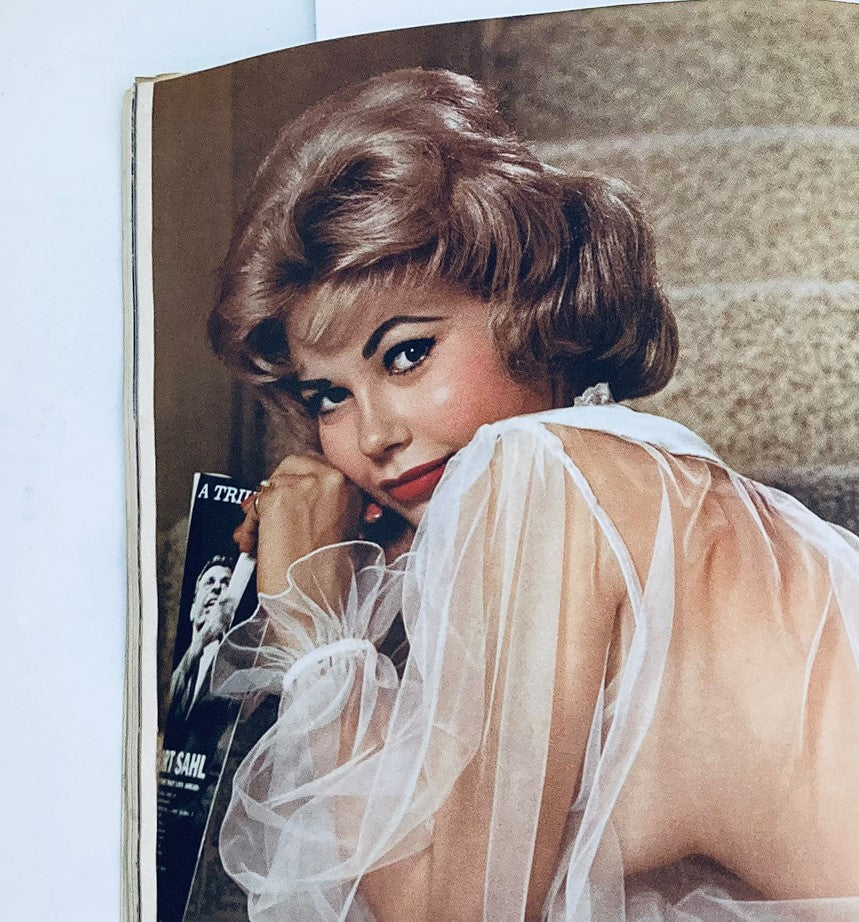 Interior page of the VTG Playboy Magazine May 1961, featuring a glamorous model in a sheer outfit, reflecting the style of the early 1960s.