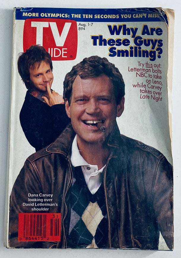 Cover of TV Guide Magazine, August 1, 1992, featuring Dana Carvey and David Letterman, with the headline 'Why Are These Guys Smiling?'. The image captures Carvey looking at Letterman, who is in the foreground smiling, showcasing the humor of the era.