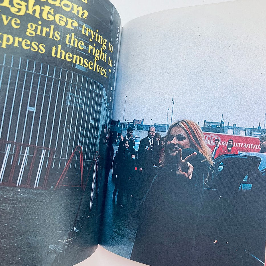 Geri Halliwell outside, encouraging girls to express themselves in the 1997 Official Spice Girls Minibook with a bold statement.