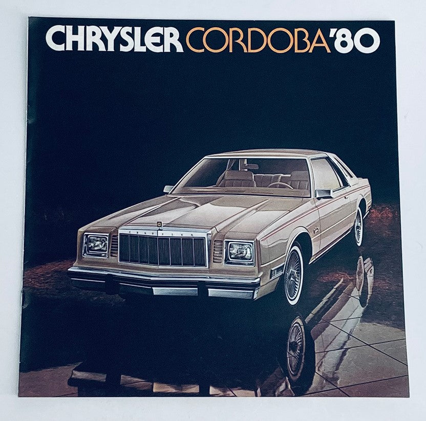 1980 Dodge Cordoba Dealer Showroom Sales Brochure featuring a stylish front view of the classic Chrysler Cordoba '80 car, showcasing its sleek design and elegance in a showroom setting.
