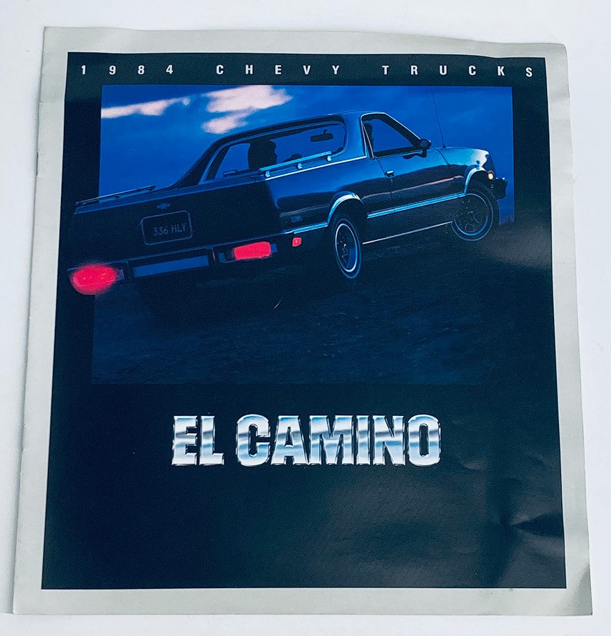 1984 Chevrolet El Camino Trucks Dealer Showroom Sales Brochure featuring a sleek El Camino truck against a twilight background, showcasing its design and style.