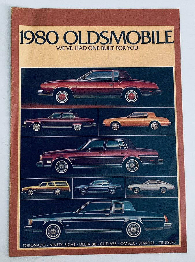 1980 Oldsmobile Lineup Dealer Showroom Sales Brochure featuring various Oldsmobile models including Toronado, Ninety-Eight, Delta 88, Cutlass, Omega, Starfire, and Cruisers, showcasing their designs and specifications.