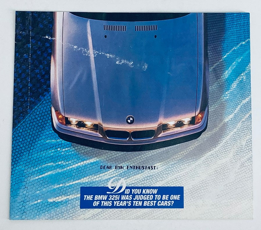 Cover image of the 1993 BMW 325i Lineup Dealer Showroom Sales Brochure Catalog, featuring a top view of a BMW vehicle and text addressing BMW enthusiasts, emphasizing its acclaim as one of the year's ten best cars.
