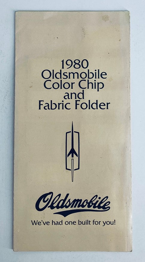 1980 Oldsmobile Color Chip Folder showcasing the front cover design featuring the Oldsmobile logo and a classic aesthetic.