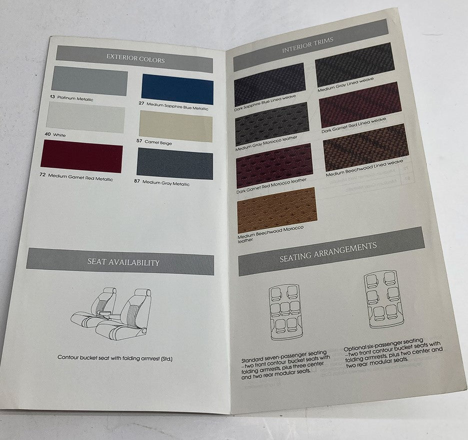 Interior page of the 1990 Oldsmobile Color Chip/Fabric Selector, displaying exterior color options, fabric selections, seat availability, and seating arrangements.