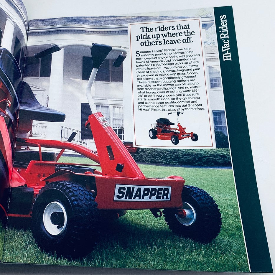 1990 Snapper Lawn Mowers Dealer Showroom Sales Guide Catalog image featuring a Snapper Hi-Vac rider mower positioned on a grassy area, showcasing the design and functionality of the mower next to a house.