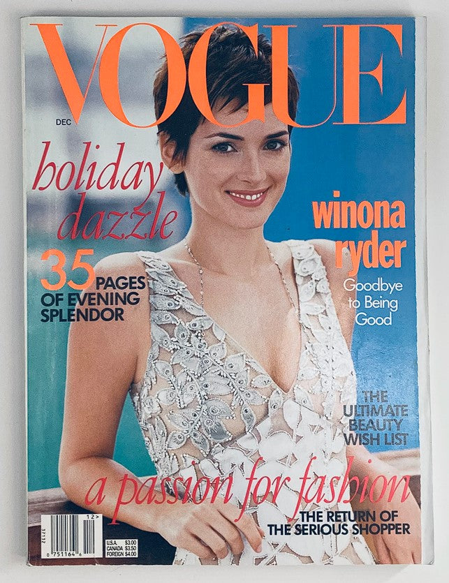 Cover of Vogue Magazine December 1996 featuring Winona Ryder with the headline 'Goodbye to Being Good.' The magazine highlights holiday fashion with a stunning image of Ryder in a detailed dress, embodying 90s style and culture.