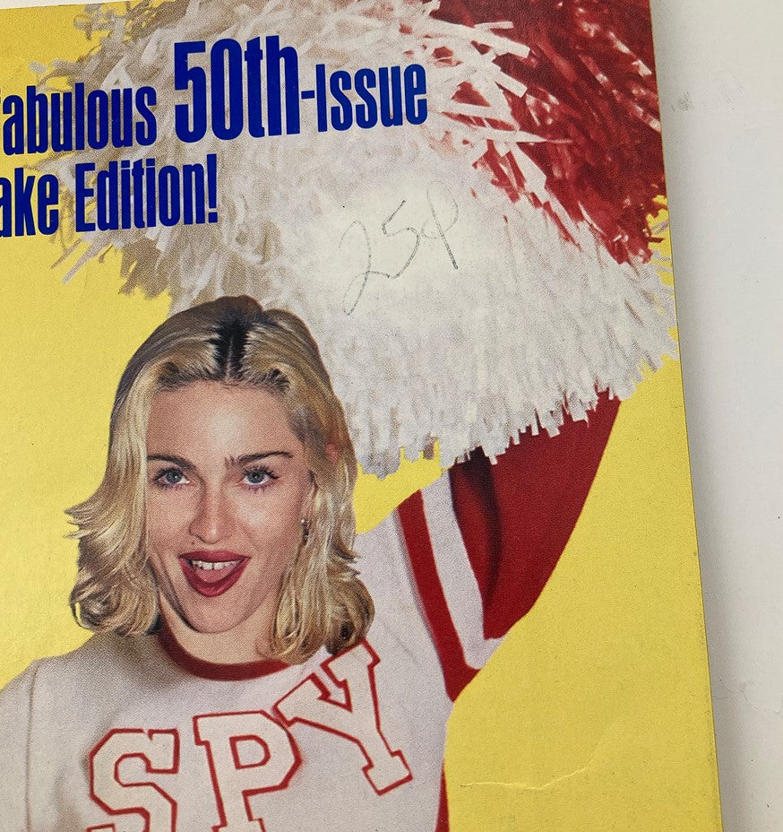 Close-up of the Spy Magazine May 1991 cover highlighting Madonna in a cheerleading outfit with pompoms, emphasis on the magazine's celebratory theme.