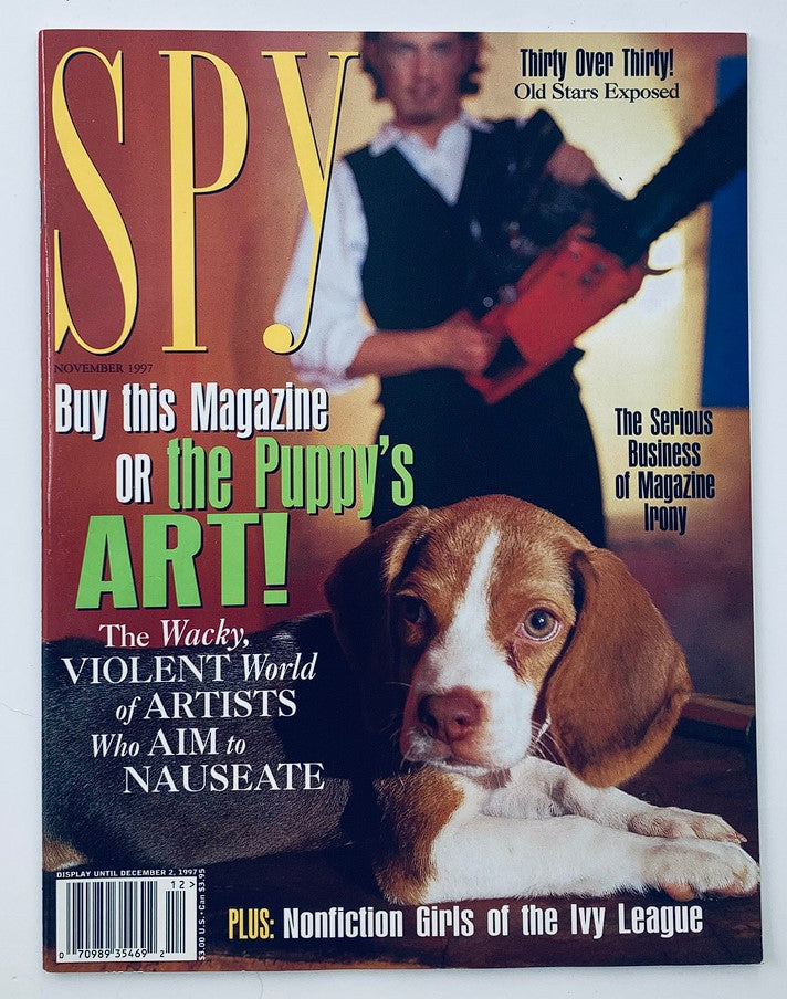 Cover of Spy Magazine November 1997 featuring the headline 'The Wacky Violent World of Artists Who Aim Nauseate' with a prominent image of a beagle puppy and various text highlights.