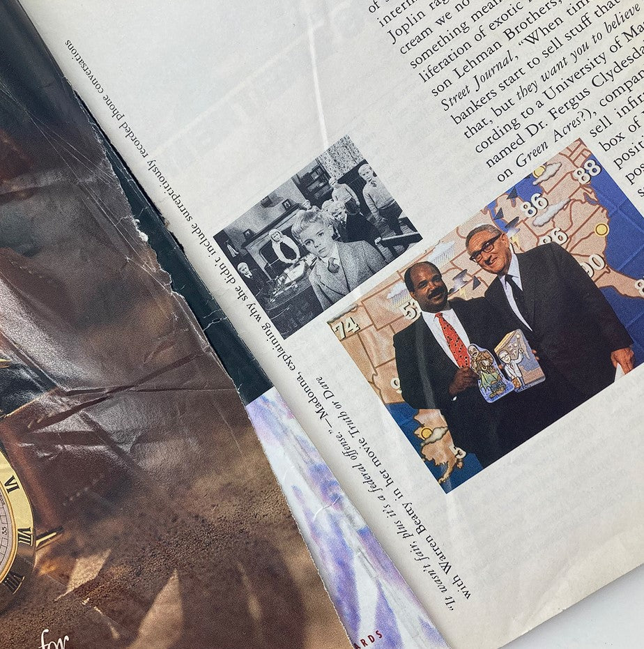 Inside page from Spy Magazine August 1991 depicting a vintage photo collage, featuring a black and white image of a woman and a color image of two men posing with a magazine, emphasizing the media's portrayal of culture and society.