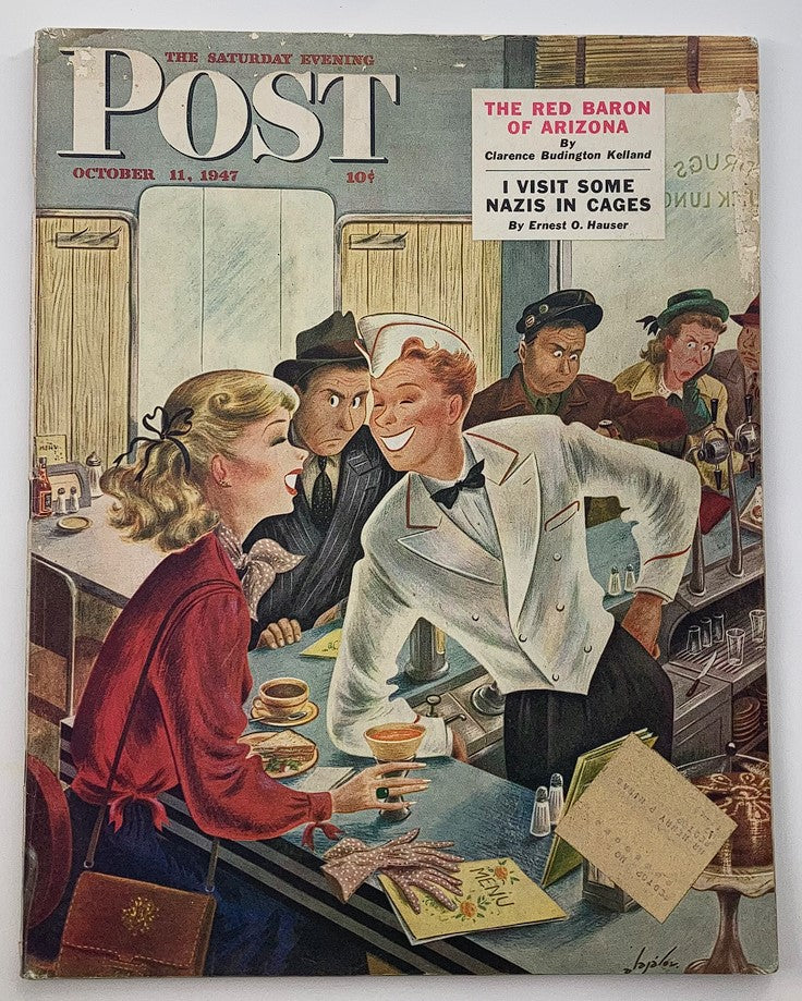The Saturday Evening Post October 11 1947 cover featuring vibrant illustrations and the article title 'I Visit Some Nazis in Cages' highlighting a post-war theme.