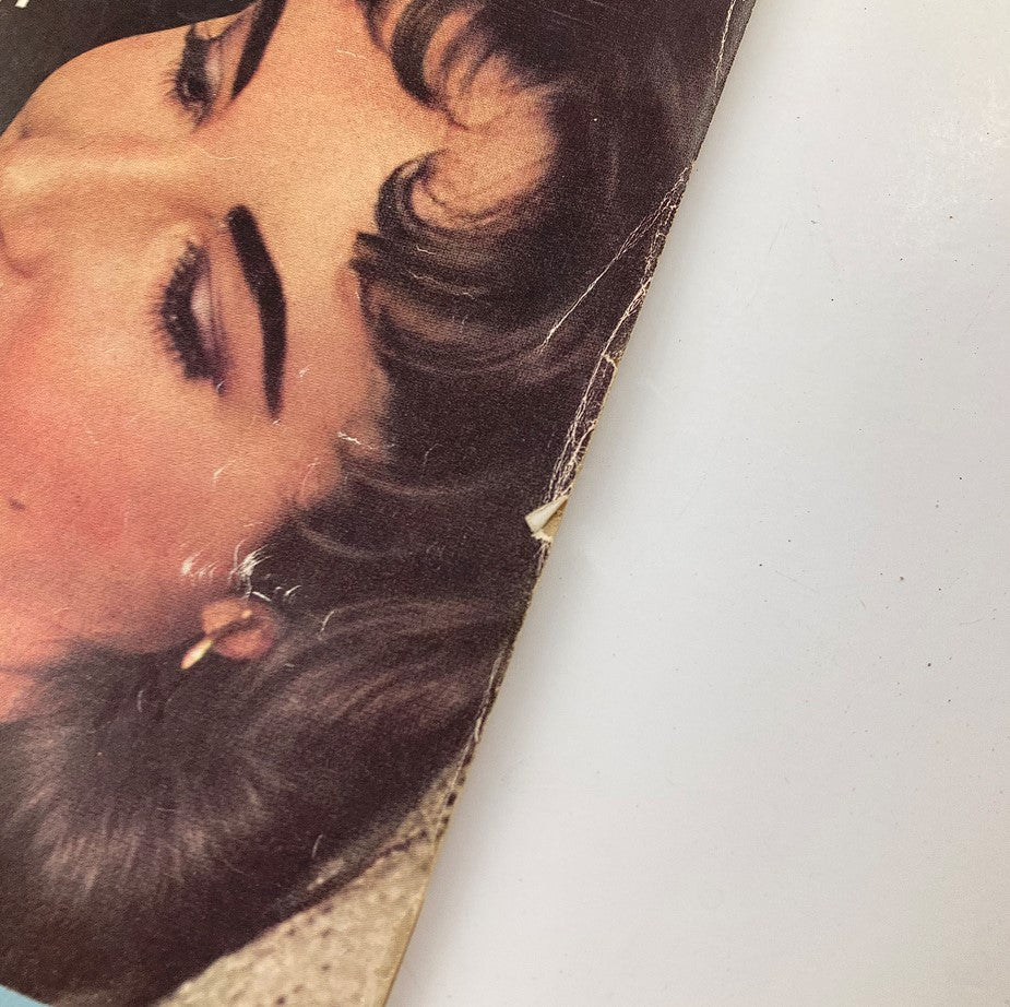 Close-up view of the VTG Modern Screen Magazine February 1958 cover highlighting Liz Taylor's hairstyle and makeup.