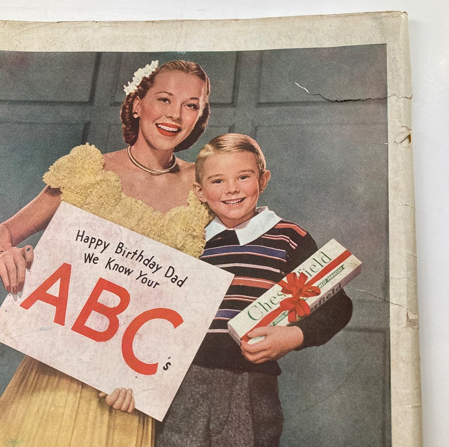 Colorful illustration from the Saturday Evening Post March 16, 1946 featuring a woman in a yellow dress and a young boy holding a sign that says 'Happy Birthday Dad We Know Your ABC's' and a gift box.