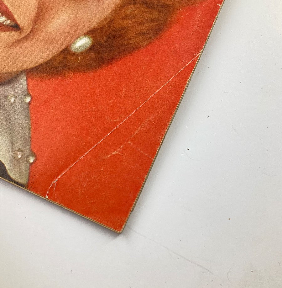 Close-up of a corner detail of the Vintage True Life Stories Magazine December 1953 Vol 1 #3, showing wear with a crack on the cover.