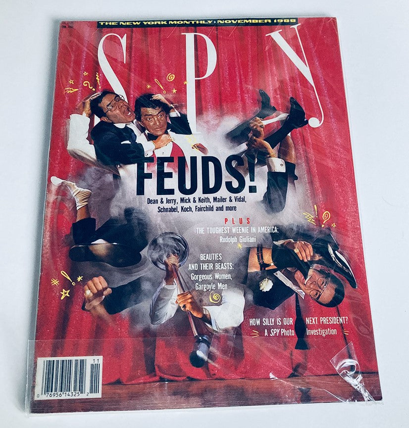 Cover of VTG Spy Magazine November 1988, showcasing a vibrant design with the headline 'FEUDS!' and illustrated caricatures related to notable public figures, encapsulating the satirical essence of the magazine.