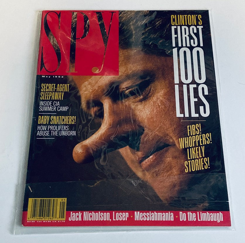 Protected cover of Spy Magazine May 1993 showing 'Clinton's First 100 Lies', in excellent condition with a plastic covering.