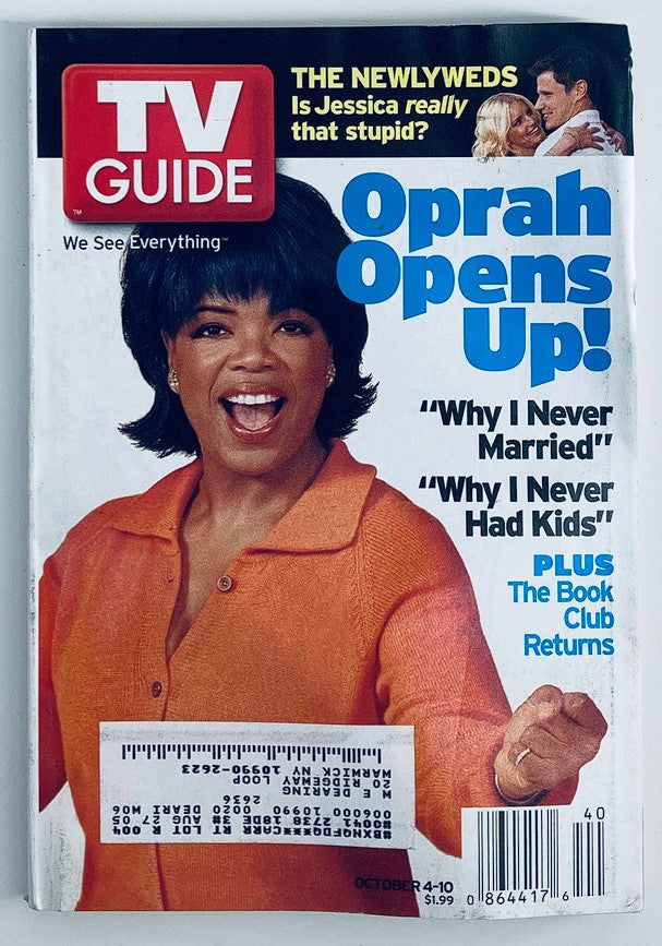 TV Guide Magazine cover from October 4, 2003 featuring Oprah Winfrey with the headline 'Oprah Opens Up!' highlighting topics including 'Why I Never Married' and 'Why I Never Had Kids', showcasing her influence on television.