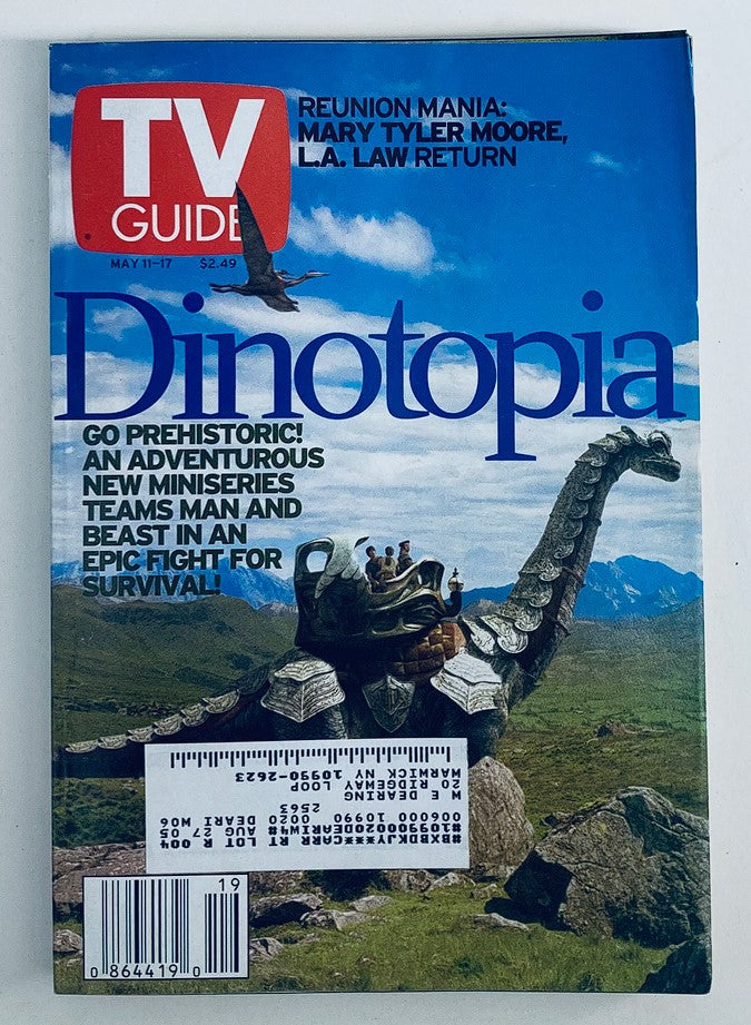 TV Guide Magazine cover from May 11, 2002, featuring Dinotopia and Mary Tyler Moore in the New York Metro Edition, highlighting a prehistoric adventure and nostalgic pop culture.