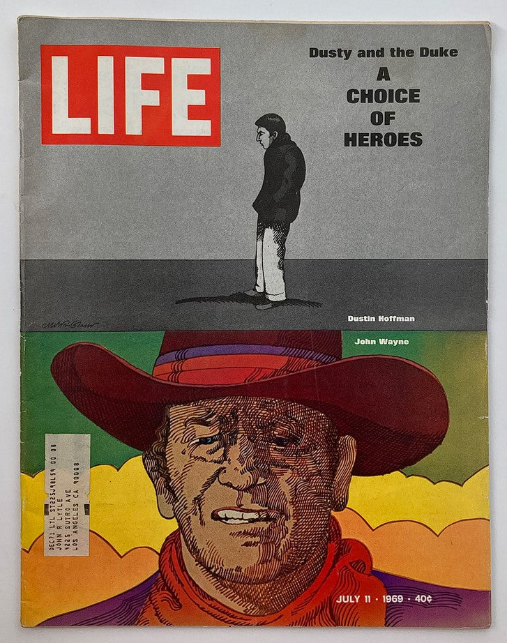 VTG Life Magazine July 11 1969 featuring Dustin Hoffman and John Wayne on the cover, showcasing the title 'Dusty and the Duke' and vibrant artwork.