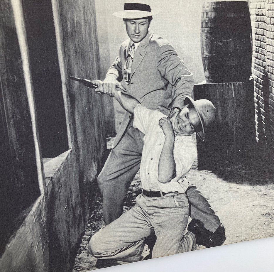 VTG Serial Pictorial 1945 #7 scene depicting Jan Wiley and Lloyd Bridges in a dramatic action moment, showcasing the thrill of the 'Secret Agent X-9' storyline.