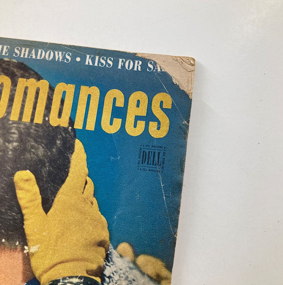 Close-up view of the Vintage Modern Romances Magazine January 1950 cover, emphasizing the magazine title and details surrounding the featured story 'Kiss for Sale,' with visible wear typical of vintage publications.