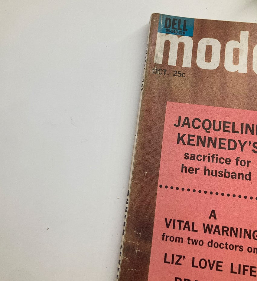 Close-up of the spine and part of the cover of VTG Modern Screen Magazine October 1962 showcasing features on Jacqueline Kennedy and Elizabeth Taylor.