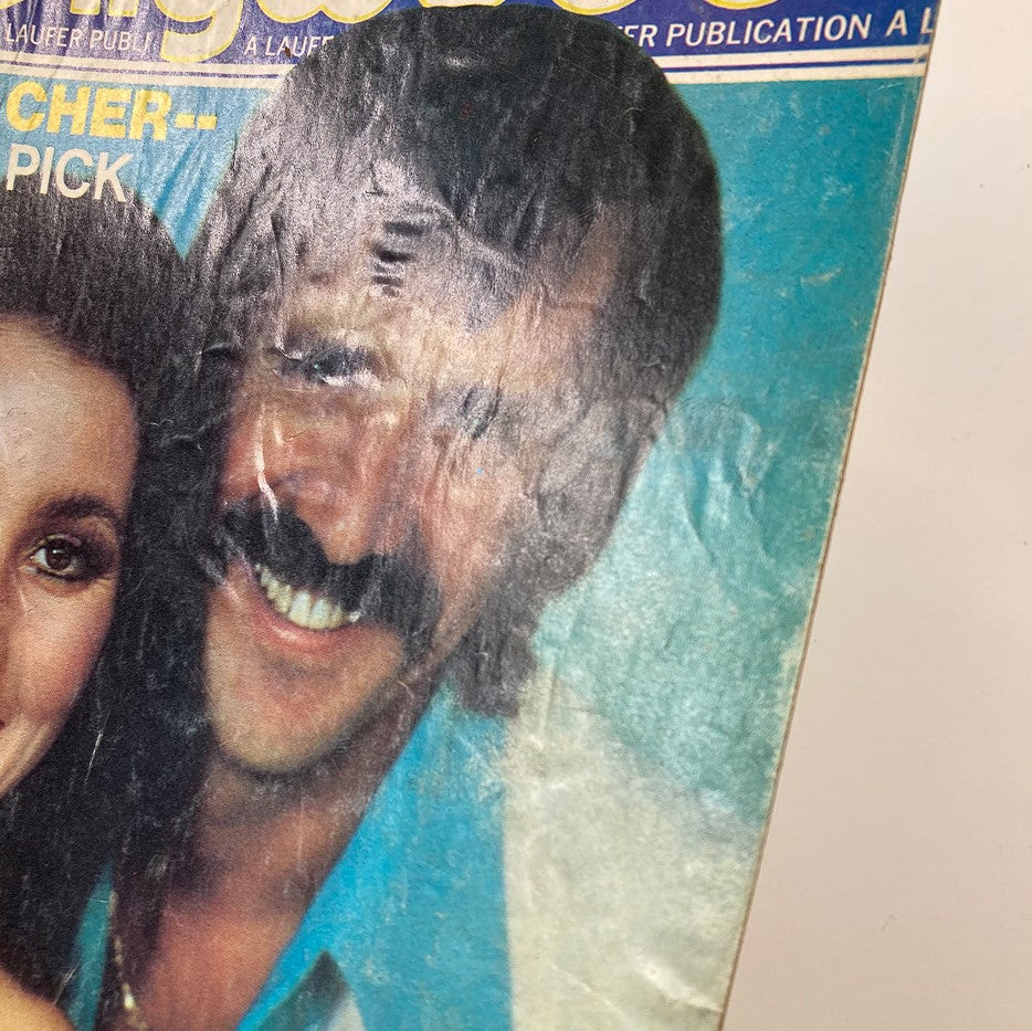 Close-up of the cover of Rona Barrett's Hollywood Magazine November 1976 showing Sonny & Cher, capturing their joyful expressions.
