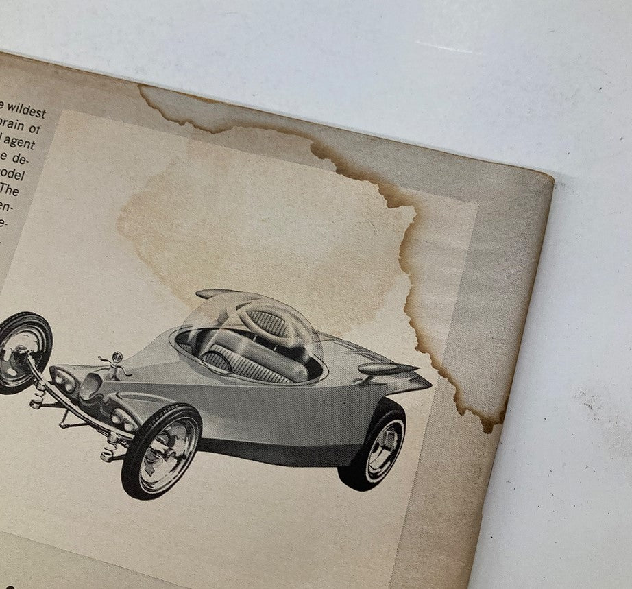 Illustration from Rod & Custom Magazine, December 1964, featuring a vintage car design with a unique futuristic look.