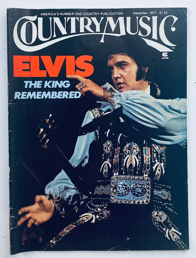 Cover of VTG Country Music Magazine December 1977 Vol 7 #3 featuring Elvis Presley with the headline 'Elvis The King Remembered'. The magazine showcases a vibrant image of Elvis performing, capturing the essence of country music during the late 1970s.