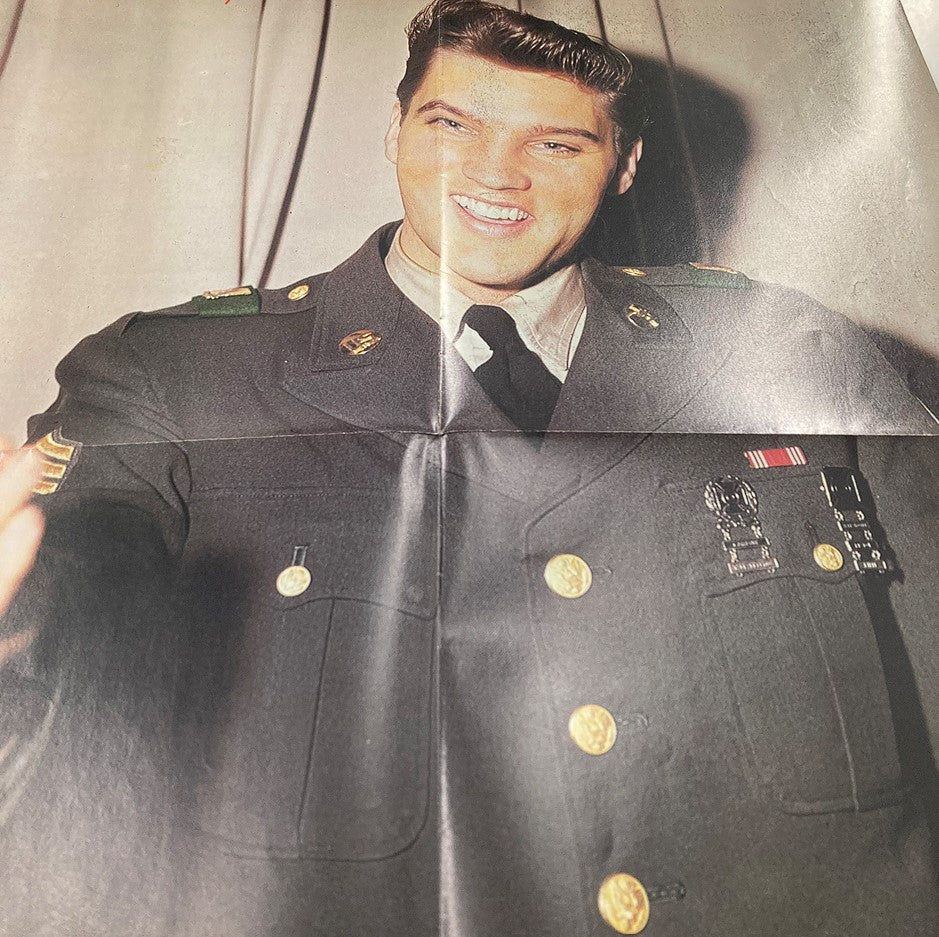 Another angle of Elvis Presley in military attire from the 1979 Elvis Presley Lives Memorial Edition Magazine, displaying his charismatic personality.