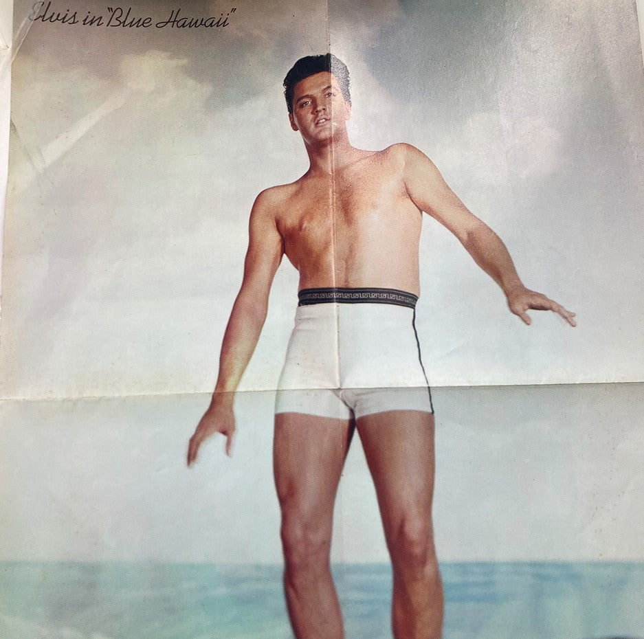 VTG 1981 Remember Elvis Presley by D.J. Fontana: Elvis Presley depicted shirtless in a vintage promotional image from 'Blue Hawaii', showcasing his classic beach hairstyle.