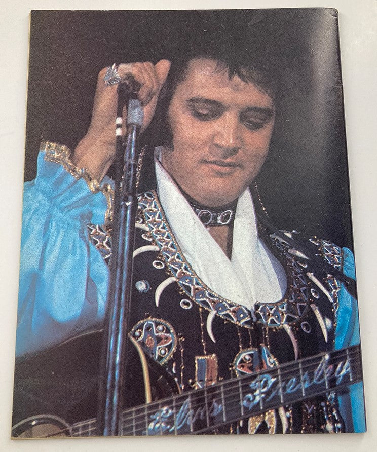VTG 1980 No. 1 The Real Elvis Presley featuring a rare color photo of Elvis Presley playing guitar, wearing a detailed blue stage outfit with ornate embellishments.
