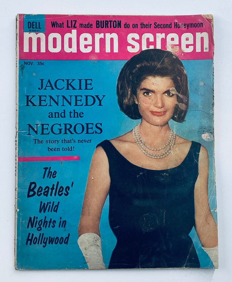 Cover of VTG Modern Screen Magazine November 1964 Vol 58 #11 featuring Jackie Kennedy, showcasing her elegance with a black dress and pearl necklace, highlighted by bold blue and pink colors, and discussing topics like Jackie Kennedy and the Negroes.