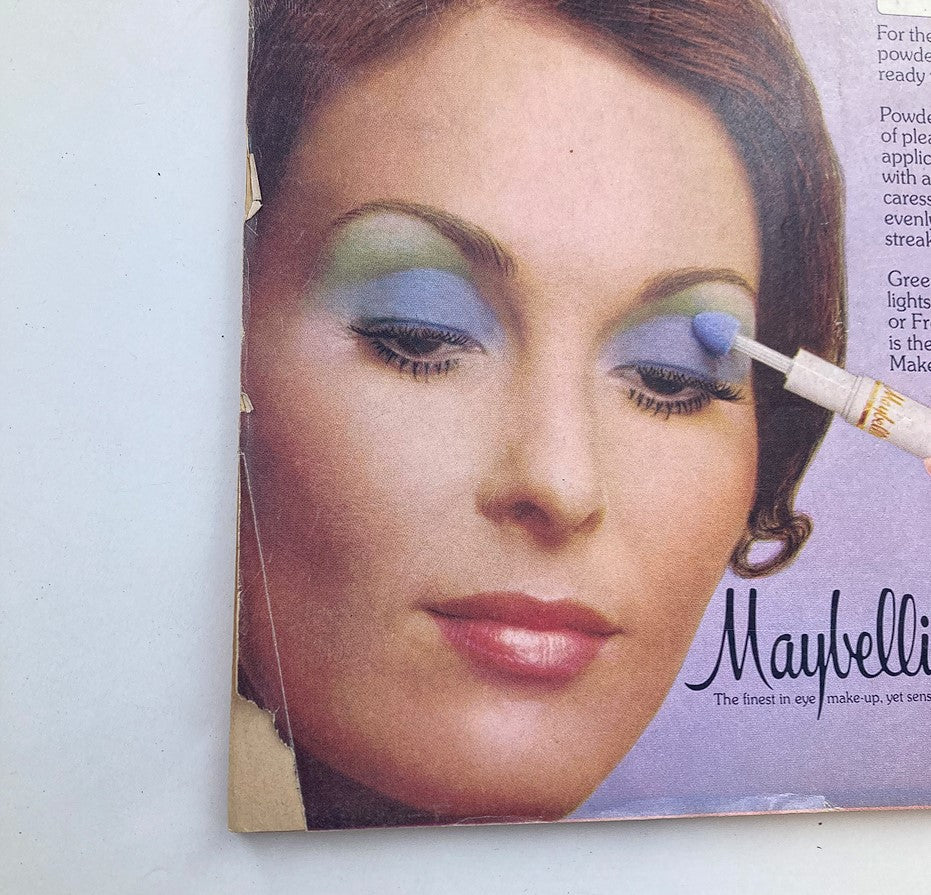 Ad page from VTG Screen Stars Magazine May 1973 featuring a model demonstrating Maybelline eye makeup style.