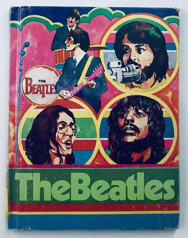 Vintage 1975 The Beatles Rock 'n Pop Stars biography book cover featuring colorful illustrations of the band members.