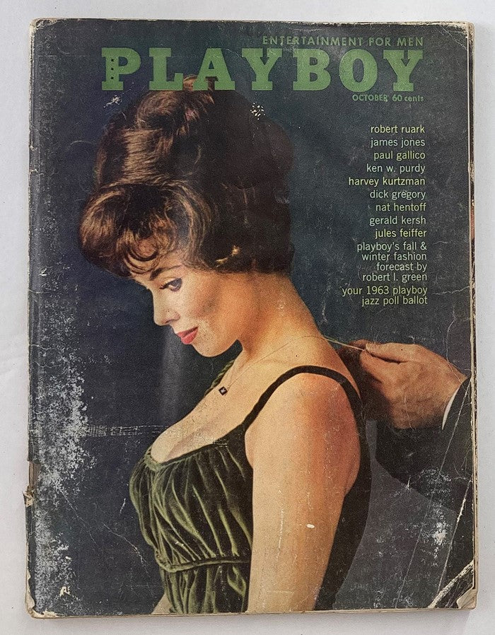 Vintage Playboy Magazine cover from October 1962 featuring Playmate of the Month Laura Young, showcasing her profile in a glamorous setting.