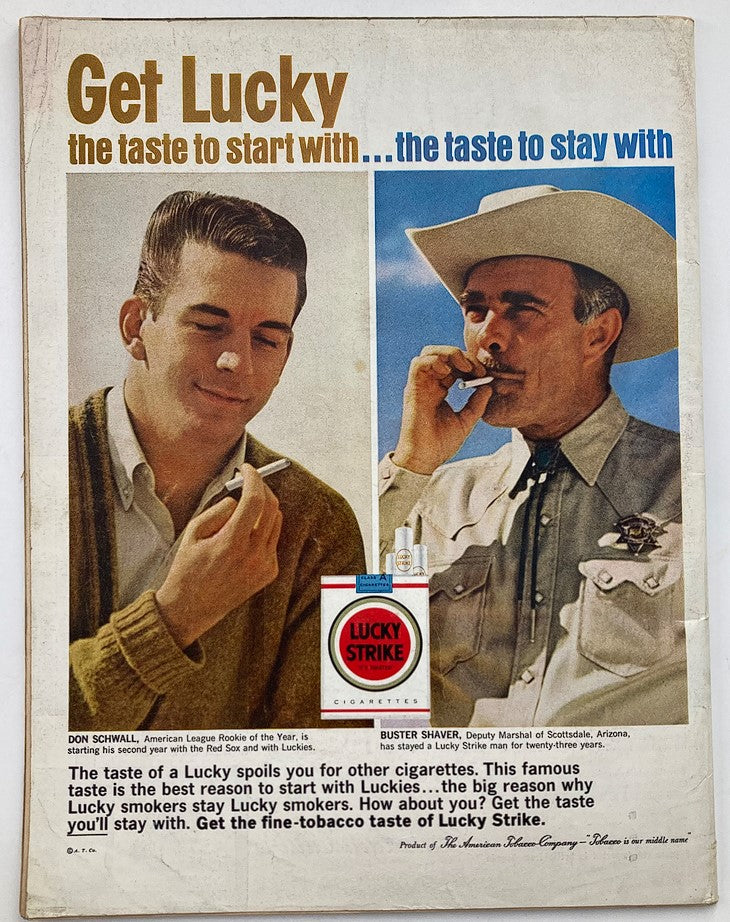 Vintage advertisement from Life Magazine featuring two men promoting Lucky Strike cigarettes, titled 'Get Lucky: the taste to start with...the taste to stay with.' This ad showcases Don Schwall, American League Rookie of the Year, and Buster Shaver, deputy marshal, highlighting the allure of Lucky Strike cigarettes.