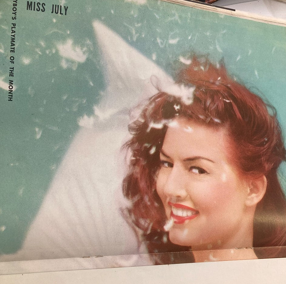 Cover of Playboy Magazine July 1956 featuring Playmate Alice Denham, with vibrant colors and a smiling expression, showcasing the iconic centerfold layout.