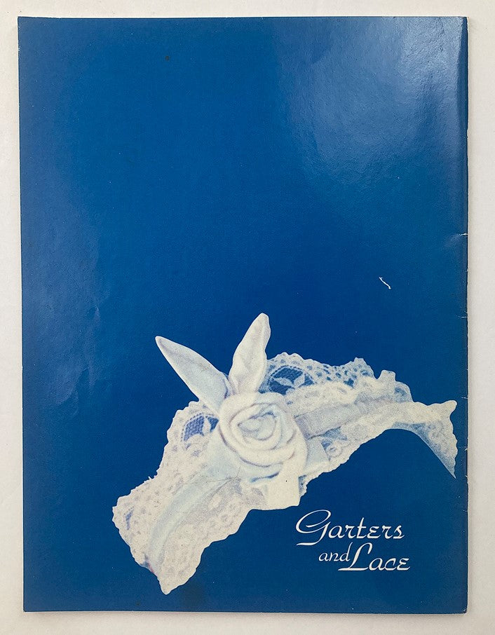 Back cover of VTG 1992 Playboy's Garters & Lace Pamela Anderson Special Collection showcasing a decorative lace garter with a rose design.