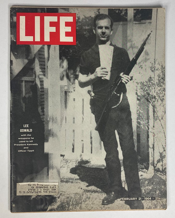 Cover of VTG Life Magazine February 21, 1964 featuring Lee Harvey Oswald holding a rifle. This issue explores pivotal events in American history.