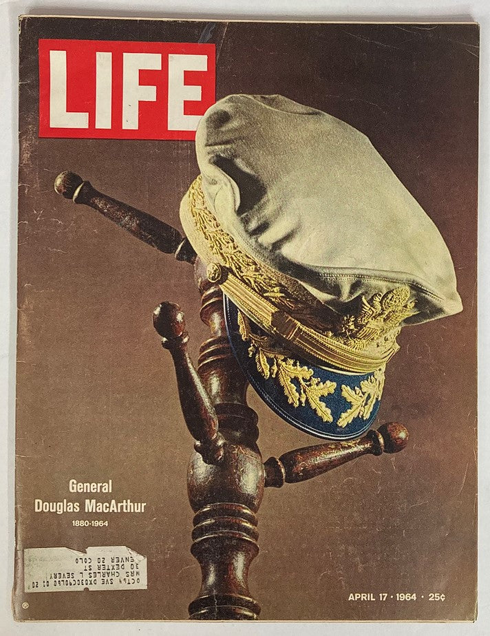 Cover of the vintage Life Magazine, April 17, 1964, featuring a tribute to General Douglas MacArthur, displaying a military cap against a wooden backdrop.