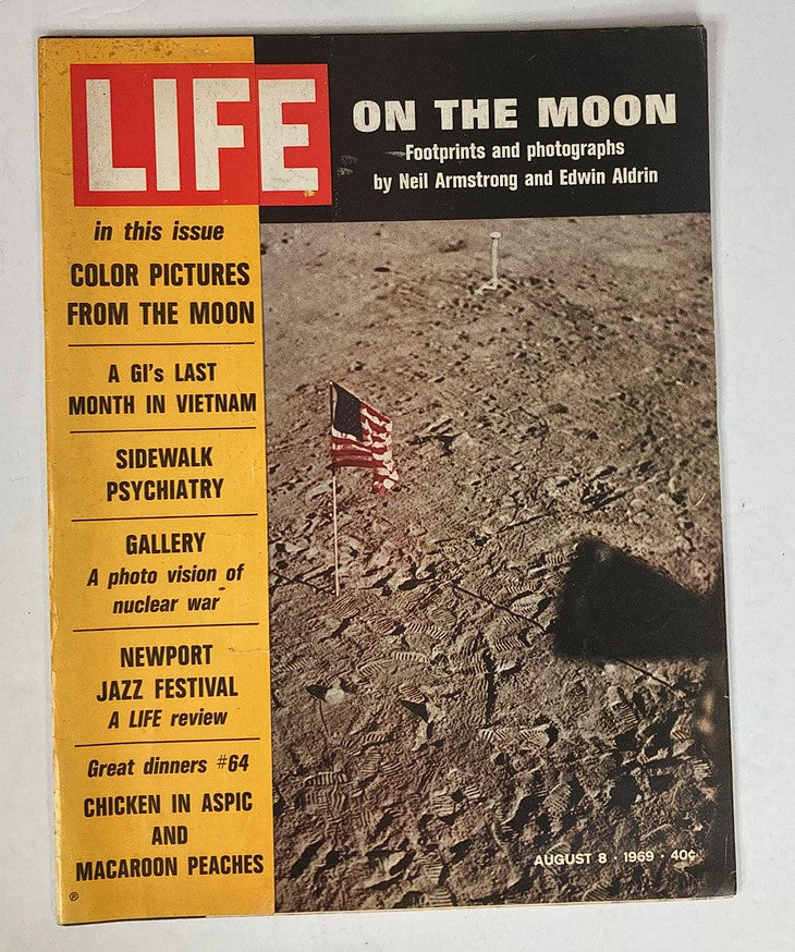 Cover of VTG Life Magazine August 8 1969 featuring the Moon landing with footprints and the American flag, capturing historical moments by Neil Armstrong and Buzz Aldrin.